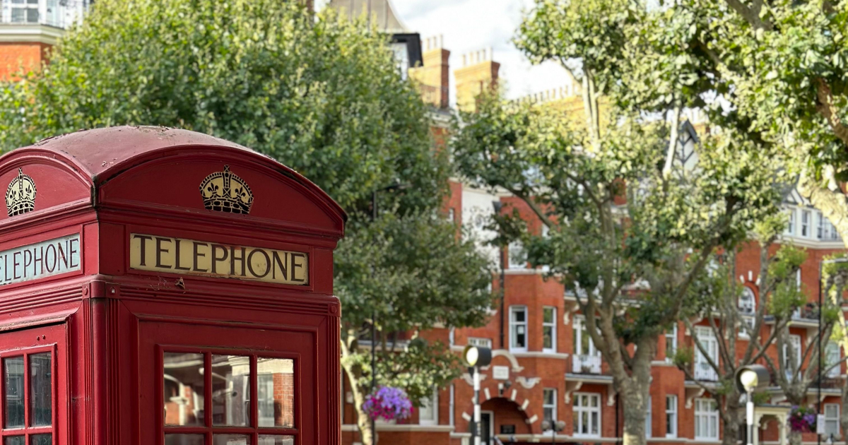 A close-up photo of an old British red telephone box.