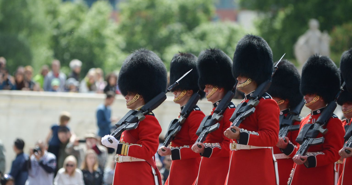 A photo of Coldstream Guards marching in ceremonial dress.